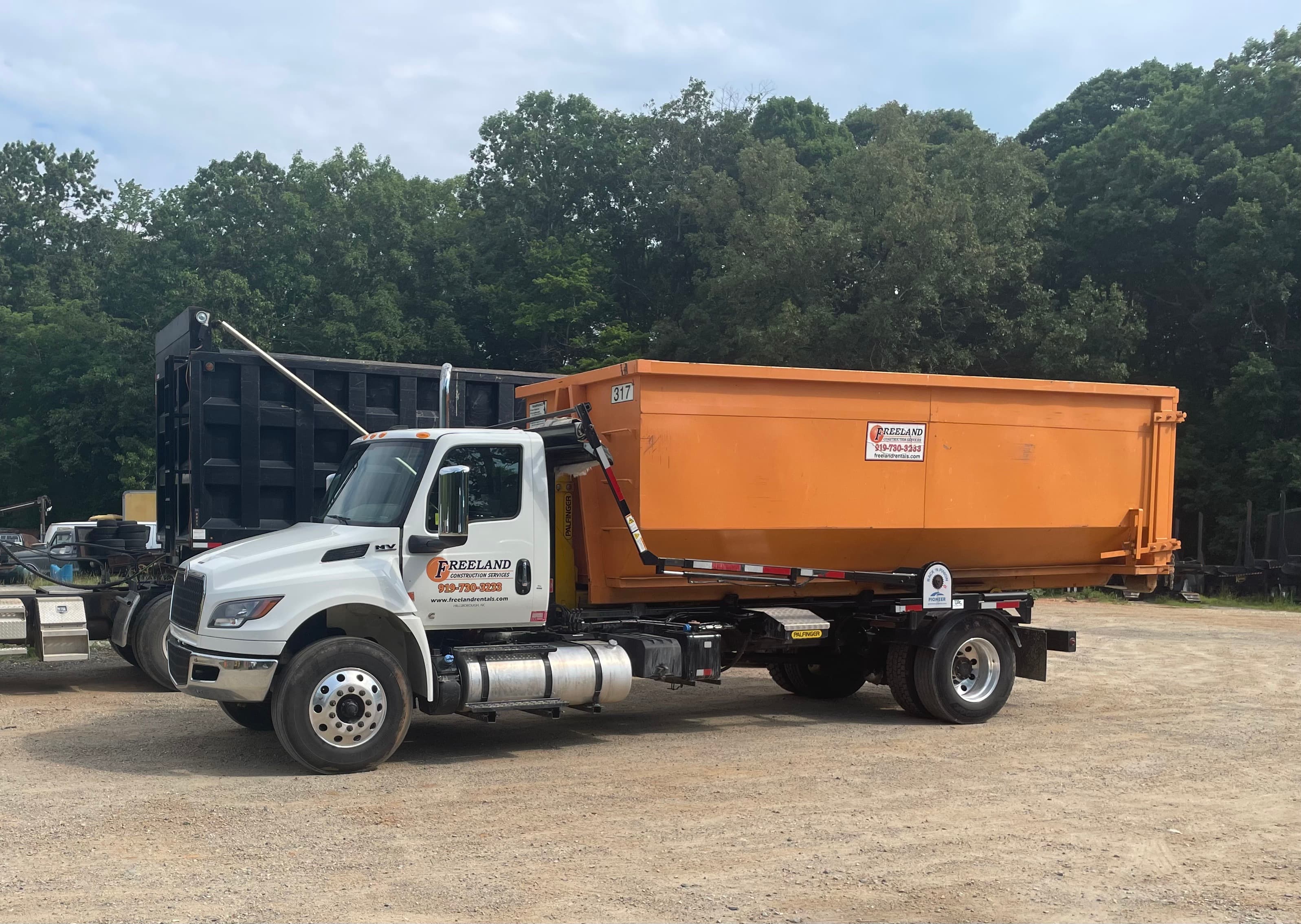 Construction dumpster on job site